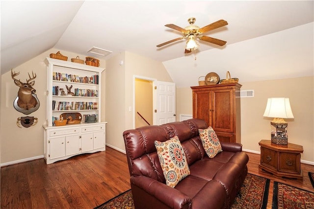 living room featuring ceiling fan, lofted ceiling, and dark wood-type flooring