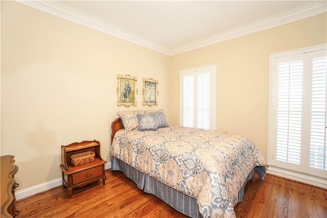 bedroom featuring hardwood / wood-style floors and ornamental molding