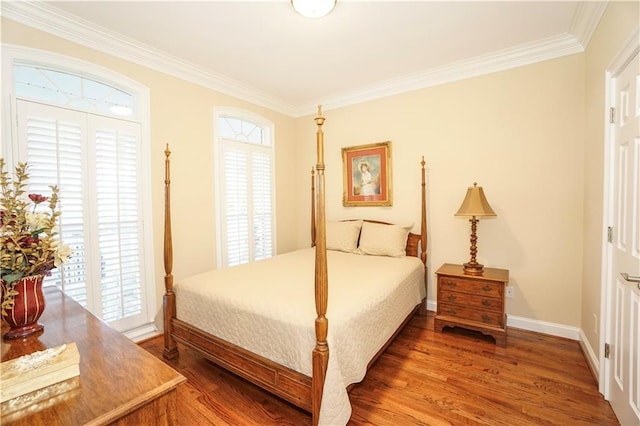 bedroom with wood-type flooring and crown molding