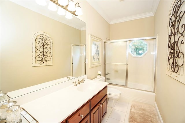 full bathroom featuring vanity, crown molding, shower / bath combination with glass door, tile patterned flooring, and toilet