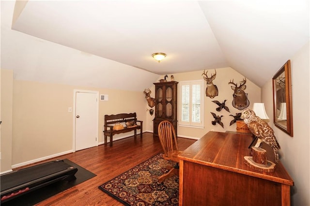 home office with wood-type flooring and vaulted ceiling