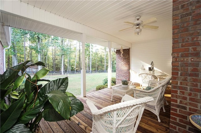 sunroom with a wealth of natural light and ceiling fan