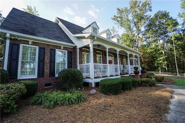 cape cod home with covered porch