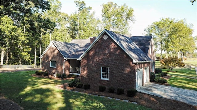 view of front of property featuring a front yard and a garage