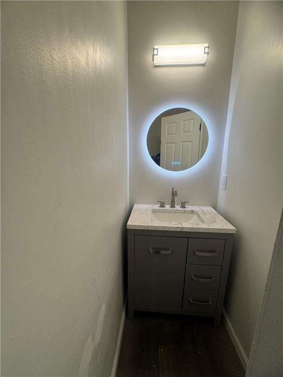 bathroom featuring vanity and baseboards