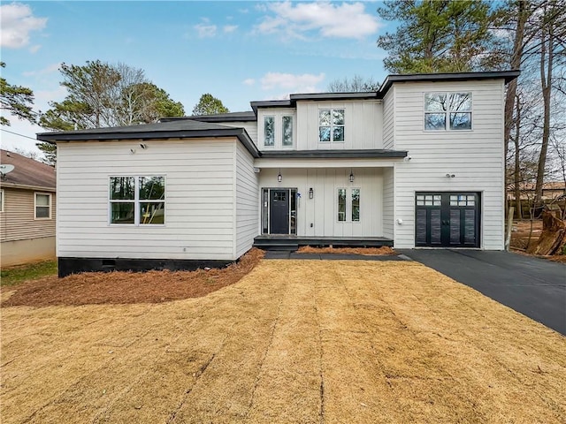 modern inspired farmhouse featuring board and batten siding, crawl space, driveway, and an attached garage