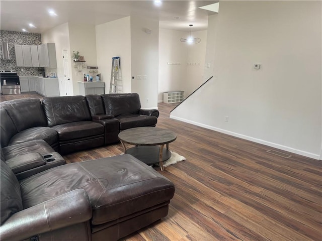 living area featuring wood finished floors and baseboards