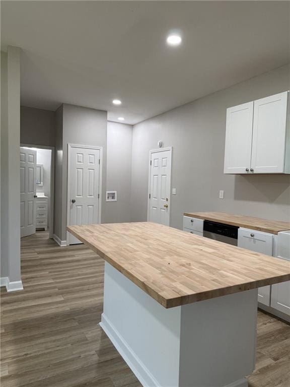 1300 Murphy Ave, Lagrange, GA 30240 - kitchen featuring wood counters, dark wood finished floors, baseboards, white cabinets, and a kitchen island