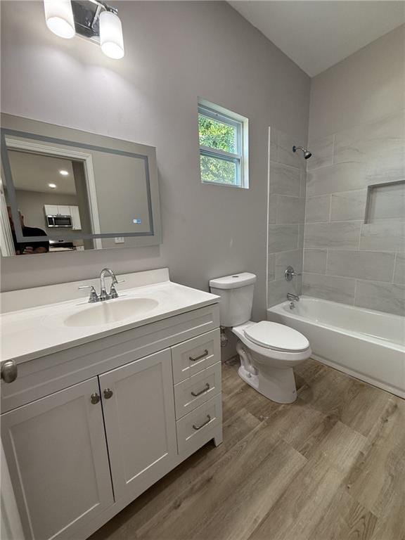 1300 Murphy Ave, Lagrange, GA 30240 - full bathroom with wood finished floors, toilet, vanity, and shower / bath combination