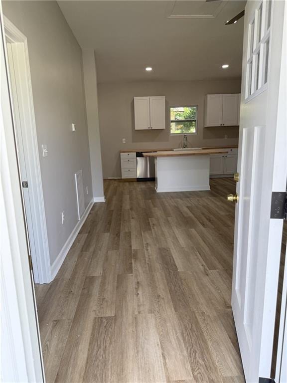 1300 Murphy Ave, Lagrange, GA 30240 - unfurnished living room with light wood finished floors, recessed lighting, a sink, and baseboards