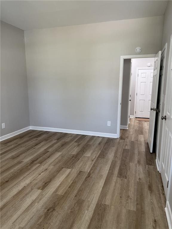 1300 Murphy Ave, Lagrange, GA 30240 - empty room with dark wood-type flooring, baseboards, and a smoke detector