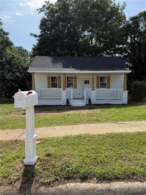 1300 Murphy Ave, Lagrange, GA 30240 - view of front of house featuring covered porch and a front lawn