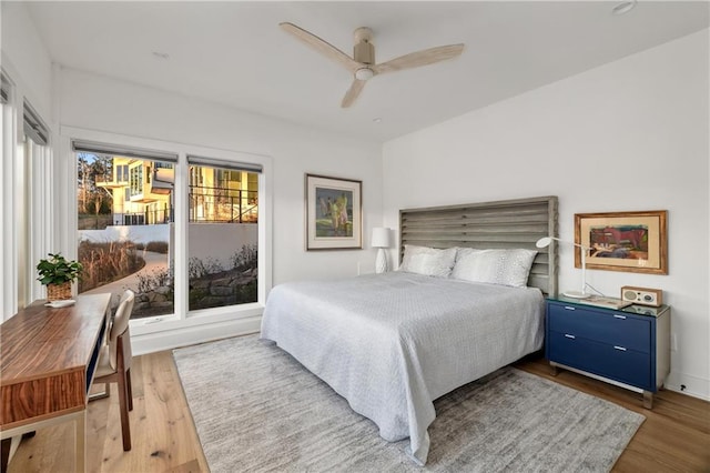 bedroom featuring hardwood / wood-style flooring and ceiling fan