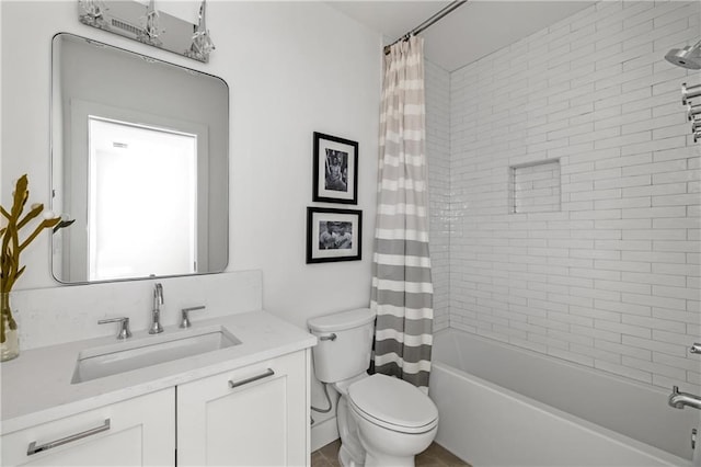 full bathroom featuring vanity, shower / bathtub combination with curtain, and toilet