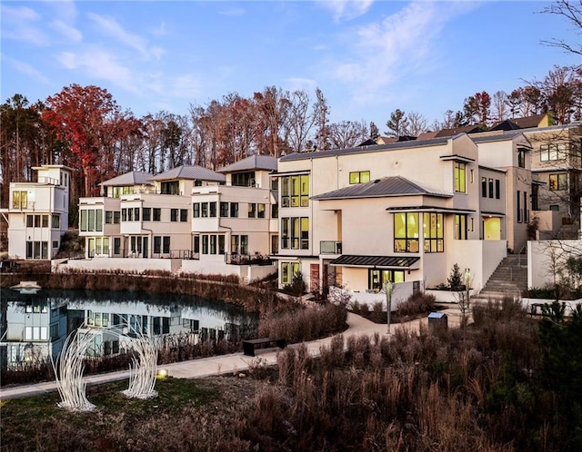 rear view of house with a water view