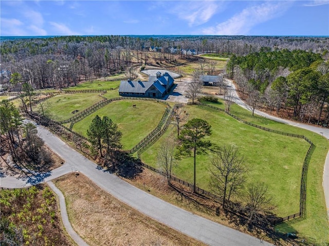 birds eye view of property with a rural view