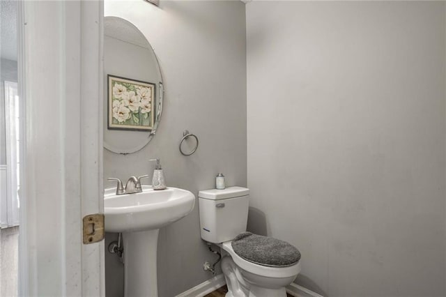 bathroom with toilet and sink