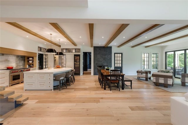 170 Autry Trl, Johns Creek, GA 30022 - dining room with beamed ceiling, light wood-style flooring, recessed lighting, and a high end fireplace