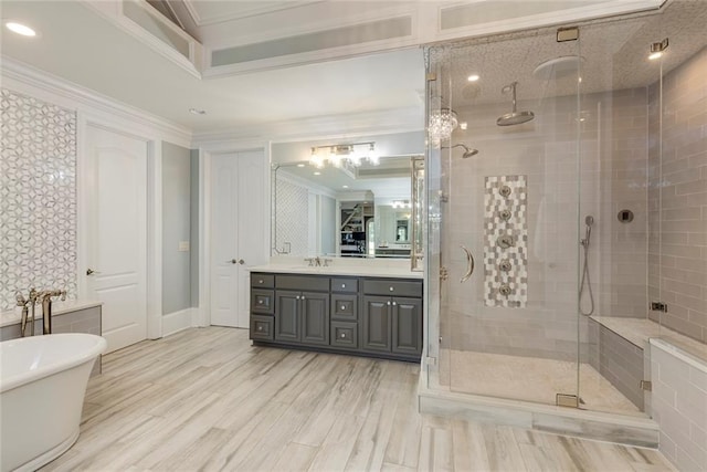 170 Autry Trl, Johns Creek, GA 30022 - full bath with double vanity, a shower stall, a freestanding tub, crown molding, and wood finished floors