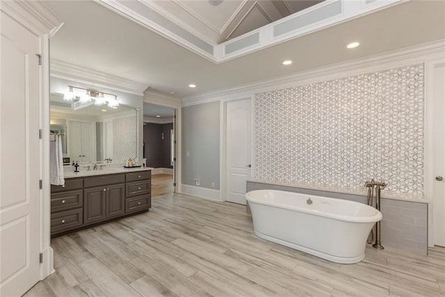 170 Autry Trl, Johns Creek, GA 30022 - bathroom with ornamental molding, vanity, a freestanding tub, wallpapered walls, and wood finished floors