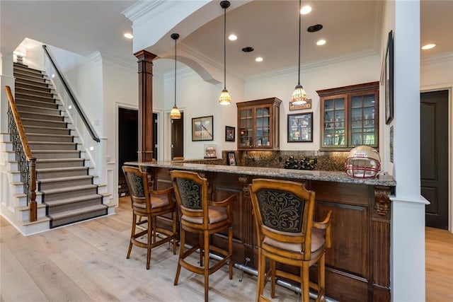 170 Autry Trl, Johns Creek, GA 30022 - indoor wet bar with ornamental molding, stairs, light wood-style floors, pendant lighting, and recessed lighting