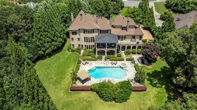 170 Autry Trl, Johns Creek, GA 30022 - back of house with a patio area, a lawn, a balcony, a pool with connected hot tub, and a sunroom