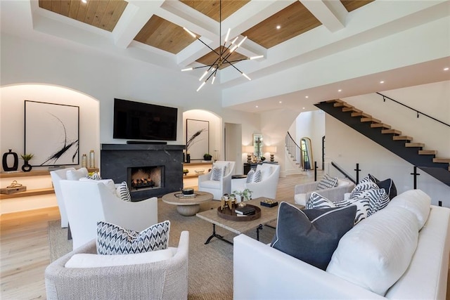170 Autry Trl, Johns Creek, GA 30022 - living room featuring arched walkways, stairway, recessed lighting, wood finished floors, and coffered ceiling