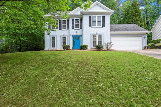 colonial-style house with a garage, stucco siding, a front yard, and concrete driveway