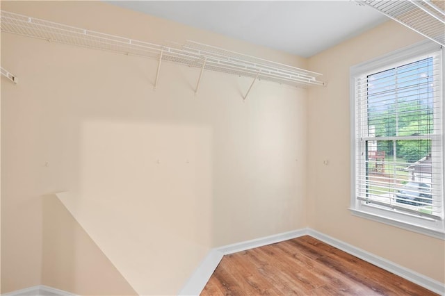 spacious closet with wood finished floors