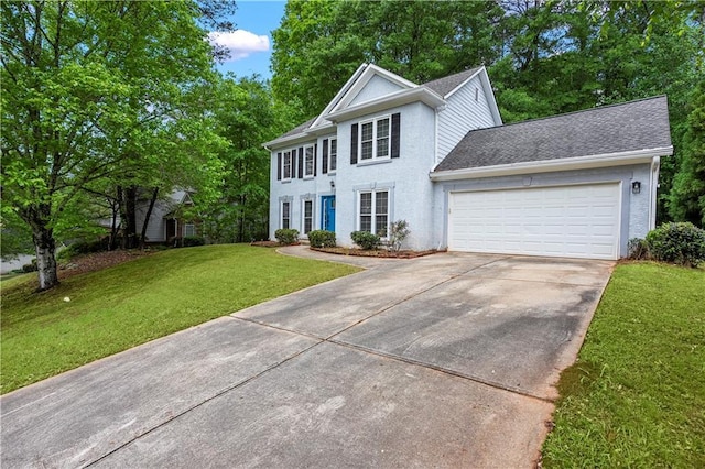 colonial-style house with a front lawn, roof with shingles, stucco siding, an attached garage, and driveway