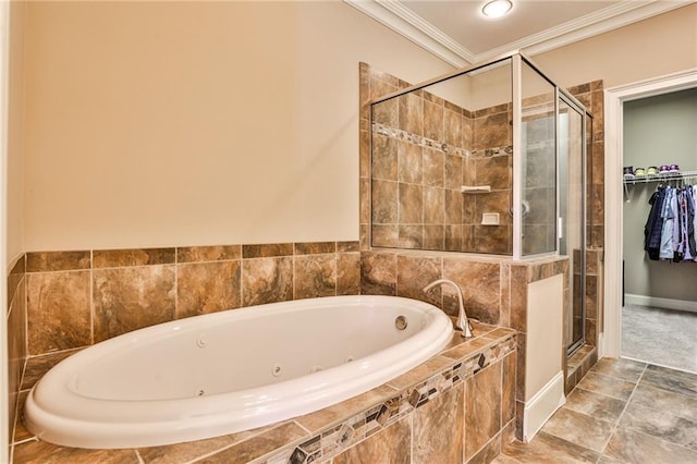 bathroom featuring ornamental molding and shower with separate bathtub