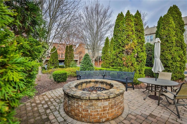 view of patio featuring an outdoor fire pit