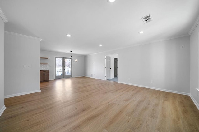 unfurnished living room with light wood-style floors, visible vents, ornamental molding, and baseboards