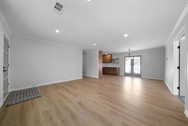 unfurnished living room with light wood finished floors, visible vents, and crown molding