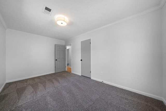 unfurnished room featuring carpet floors, baseboards, visible vents, and ornamental molding