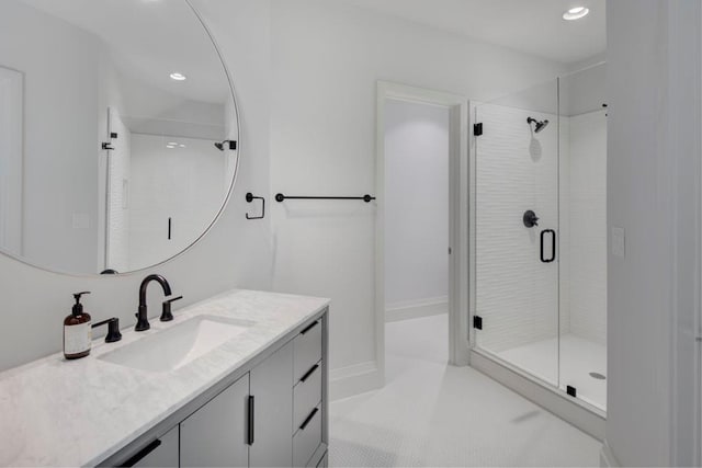 full bath featuring tile patterned flooring, recessed lighting, vanity, baseboards, and a shower stall