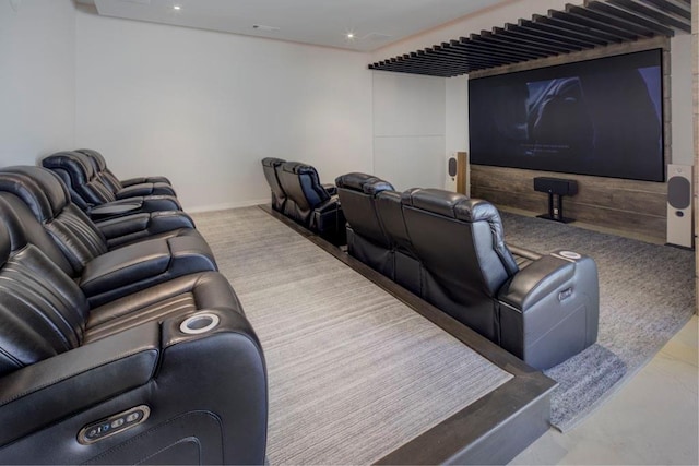 carpeted cinema room with recessed lighting