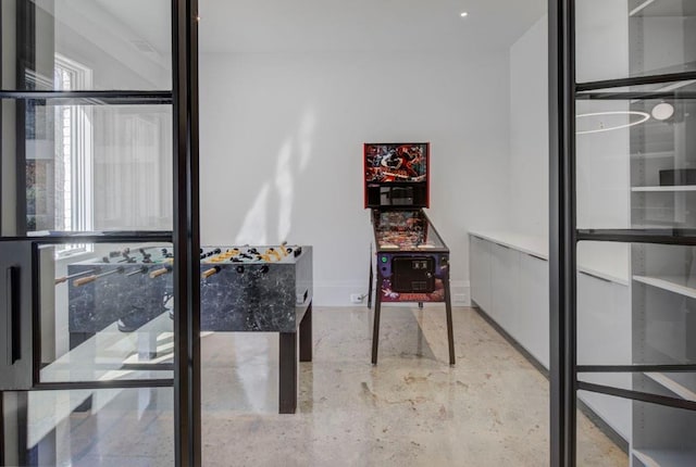 home office with concrete floors and baseboards