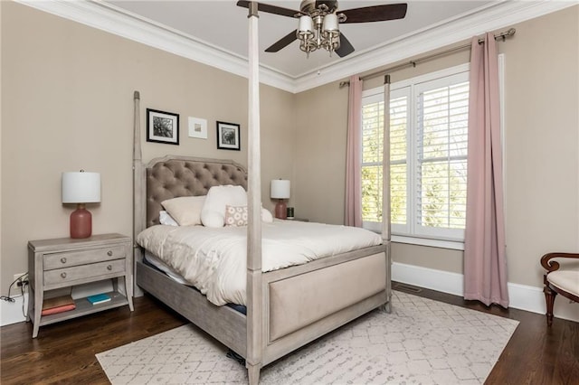 bedroom with ceiling fan, baseboards, crown molding, and wood finished floors