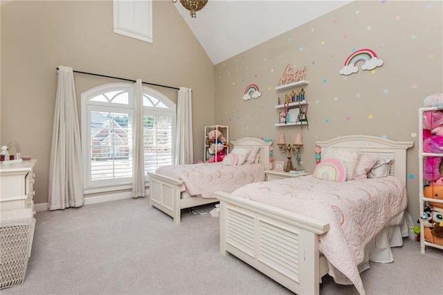 bedroom featuring high vaulted ceiling and light colored carpet