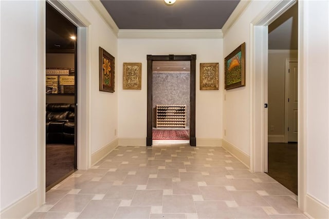 corridor with crown molding and baseboards