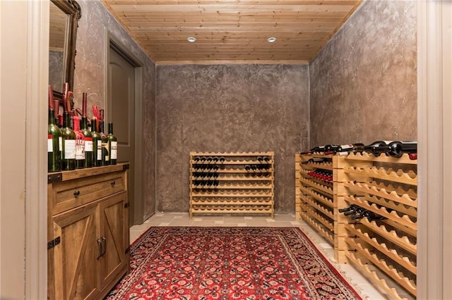 wine area with wooden ceiling and light tile patterned floors