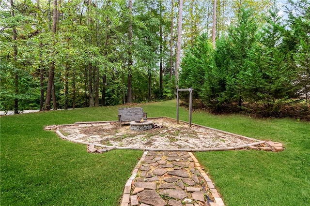 view of yard with a fire pit