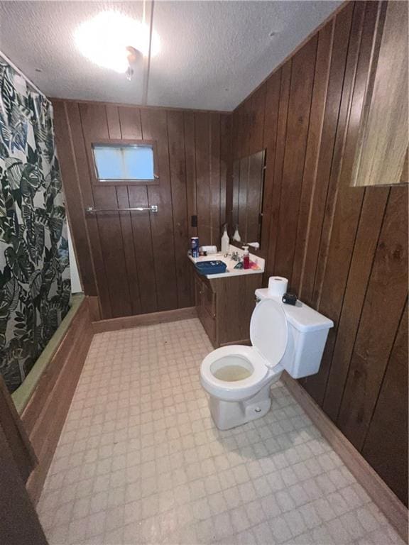 full bathroom featuring wooden walls and shower / bathtub combination with curtain