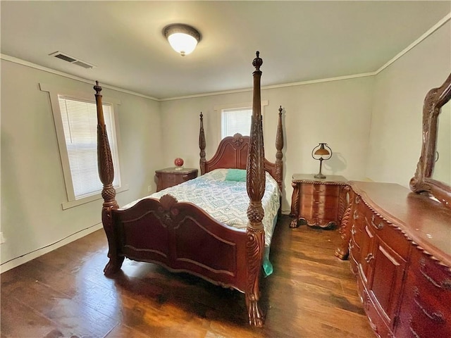 bedroom with crown molding and dark wood-type flooring