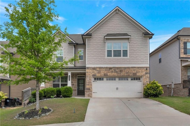 2320 Ivy Birch Ln, Buford, GA 30519 - craftsman house featuring stone siding, driveway, a garage, and a front yard
