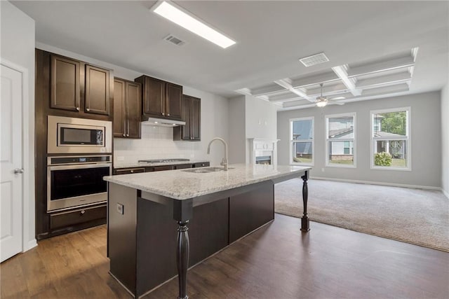 2320 Ivy Birch Ln, Buford, GA 30519 - kitchen with appliances with stainless steel finishes, a sink, coffered ceiling, open floor plan, and a kitchen bar