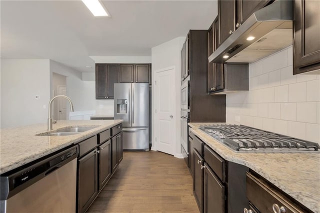 2320 Ivy Birch Ln, Buford, GA 30519 - kitchen featuring appliances with stainless steel finishes, under cabinet range hood, a sink, dark brown cabinets, and recessed lighting