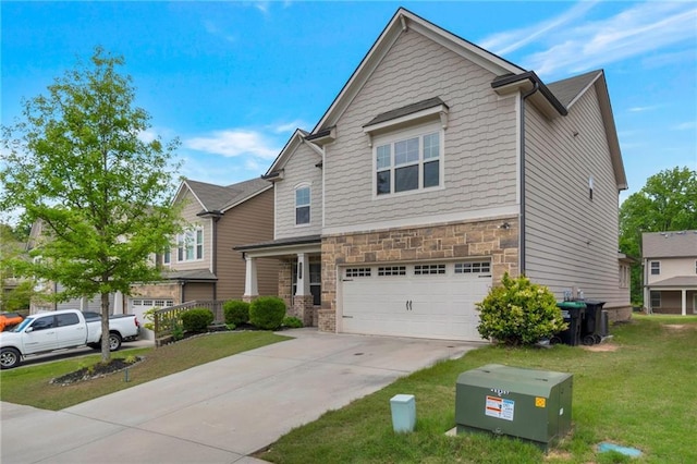2320 Ivy Birch Ln, Buford, GA 30519 - view of front facade featuring a garage, a front yard, driveway, and stone siding
