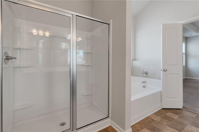 2320 Ivy Birch Ln, Buford, GA 30519 - full bathroom featuring a stall shower, a garden tub, and baseboards
